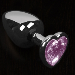 Фото маленькая серебристая анальная пробка с кристаллом в виде сердечка в профессиональном Секс Шопе