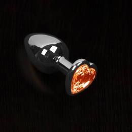 Фото большая серебристая анальная пробка с кристаллом в виде сердечка в профессиональном Секс Шопе