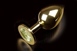 Фото велика золотиста анальна пробка з кристалом в профессиональном Секс Шопе